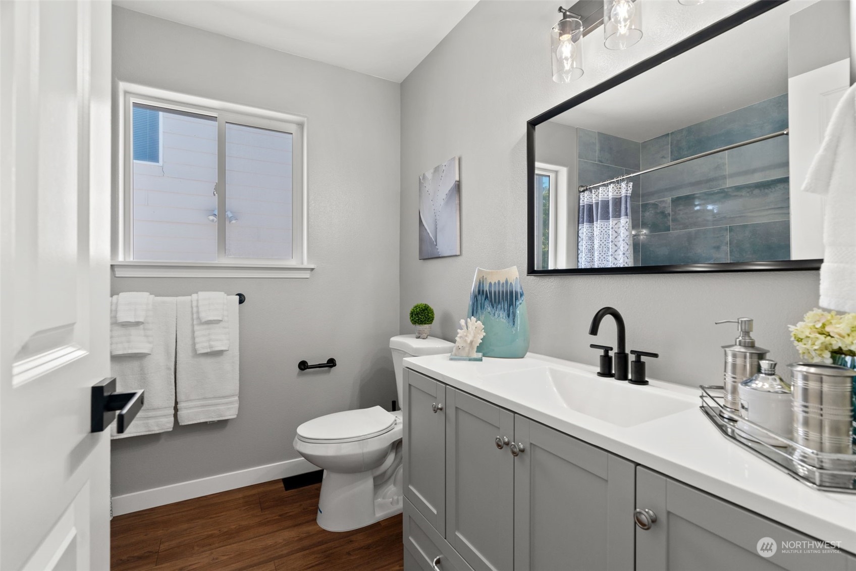 1208 South 35th Street Renton, WA 98055 - Photo 17 of 26 a bathroom with a toilet sink and mirror