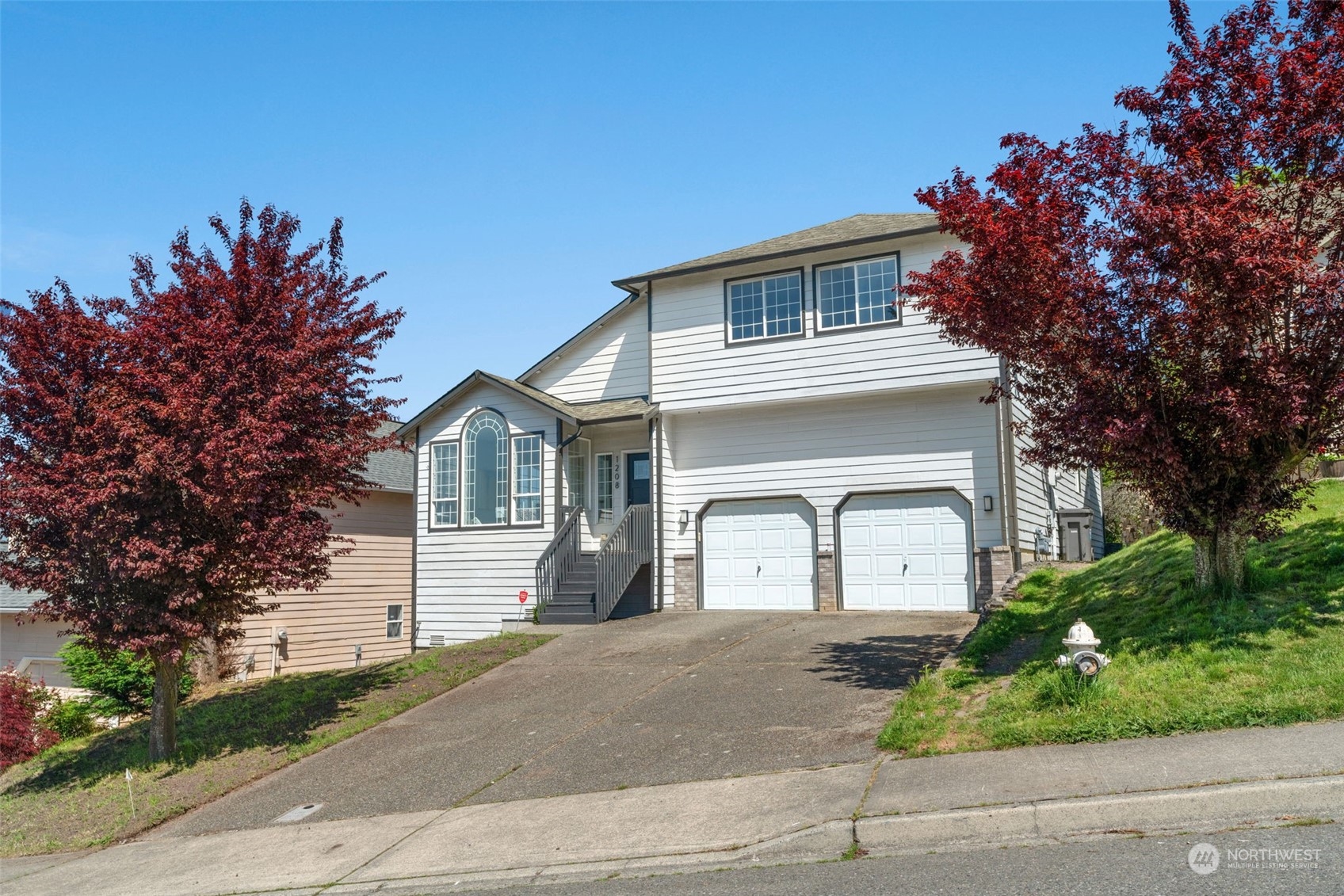 1208 South 35th Street Renton, WA 98055 - Photo 2 of 26 front view of a house with a garden