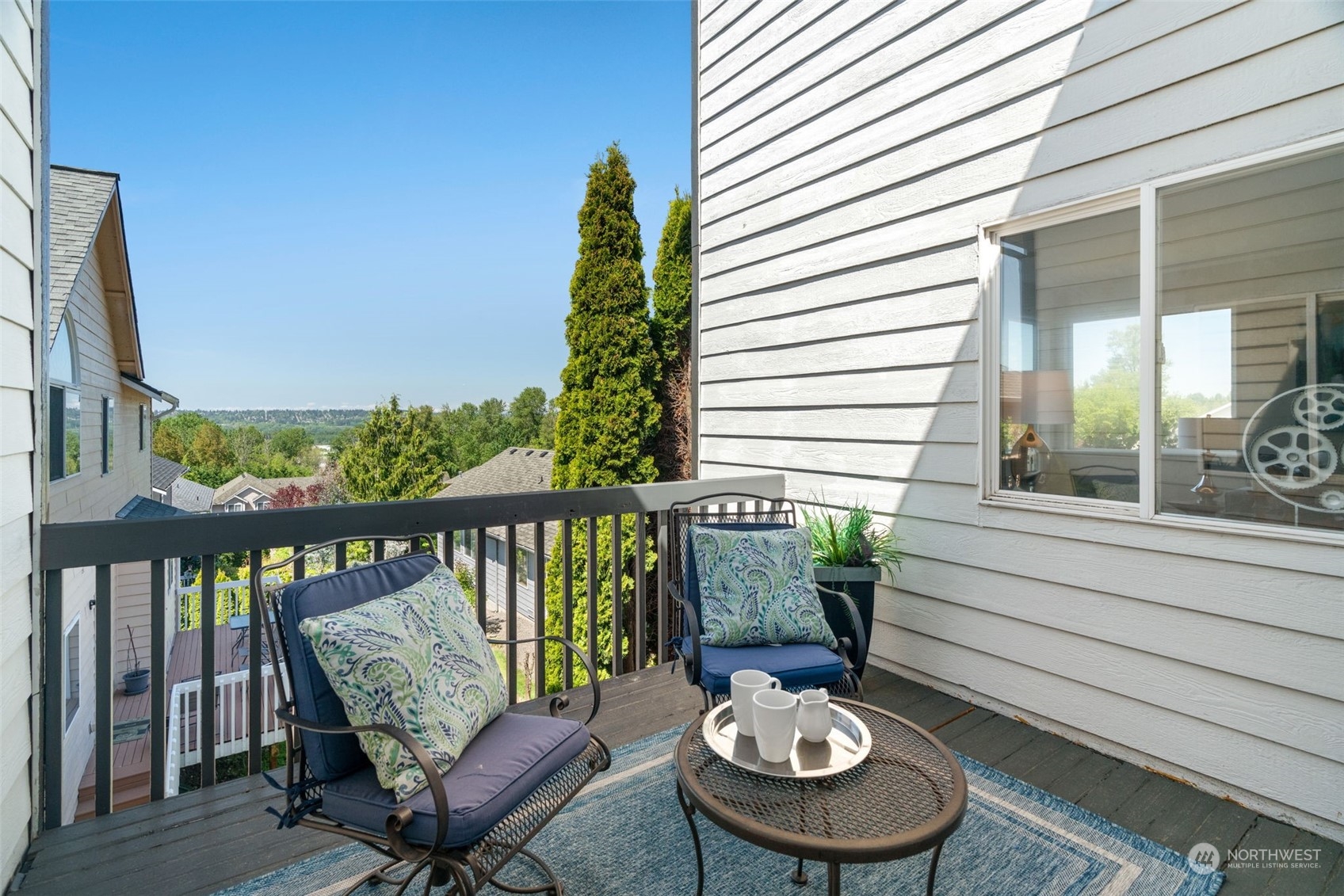 1208 South 35th Street Renton, WA 98055 - Photo 5 of 26 a view of a balcony with chairs and a table