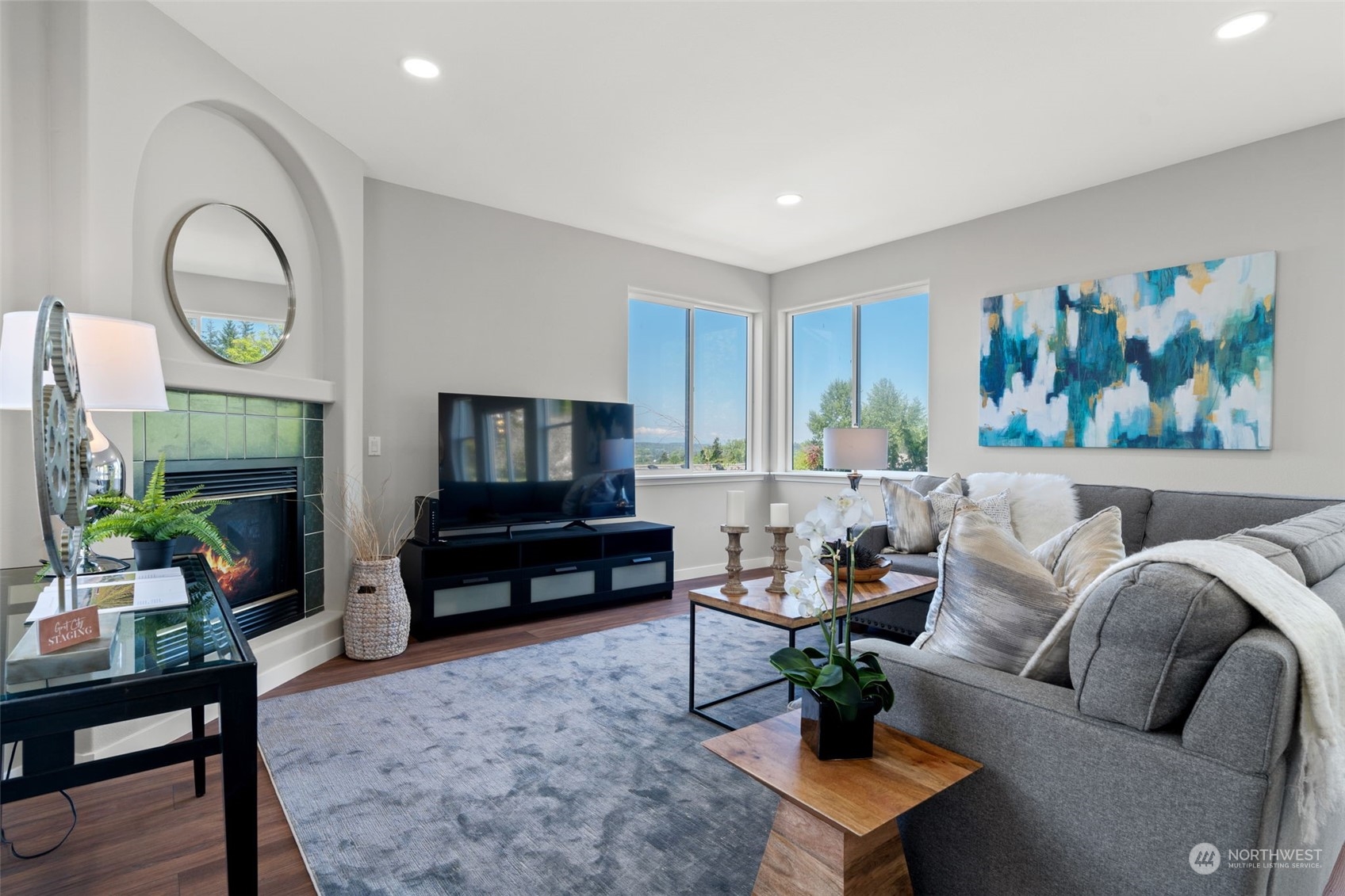 1208 South 35th Street Renton, WA 98055 - Photo 7 of 26 a living room with furniture a fireplace and a potted plant