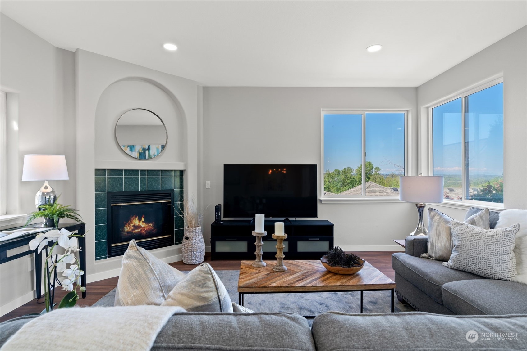 1208 South 35th Street Renton, WA 98055 - Photo 8 of 26 a living room with furniture a fireplace and a flat screen tv