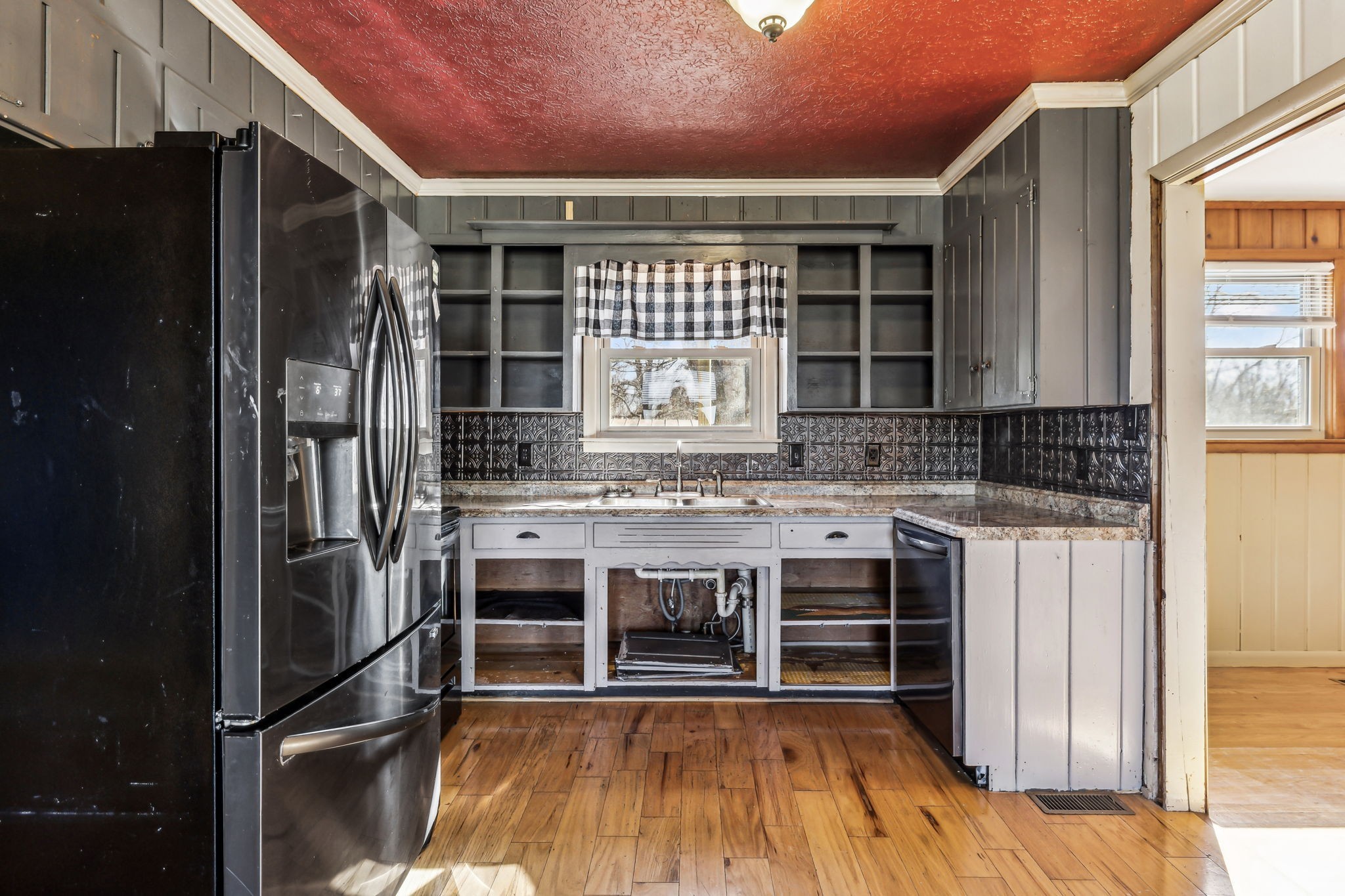 1170 Jim Read Road Ashland City, TN 37015 - Photo 11 of 39 a kitchen with a sink and a refrigerator