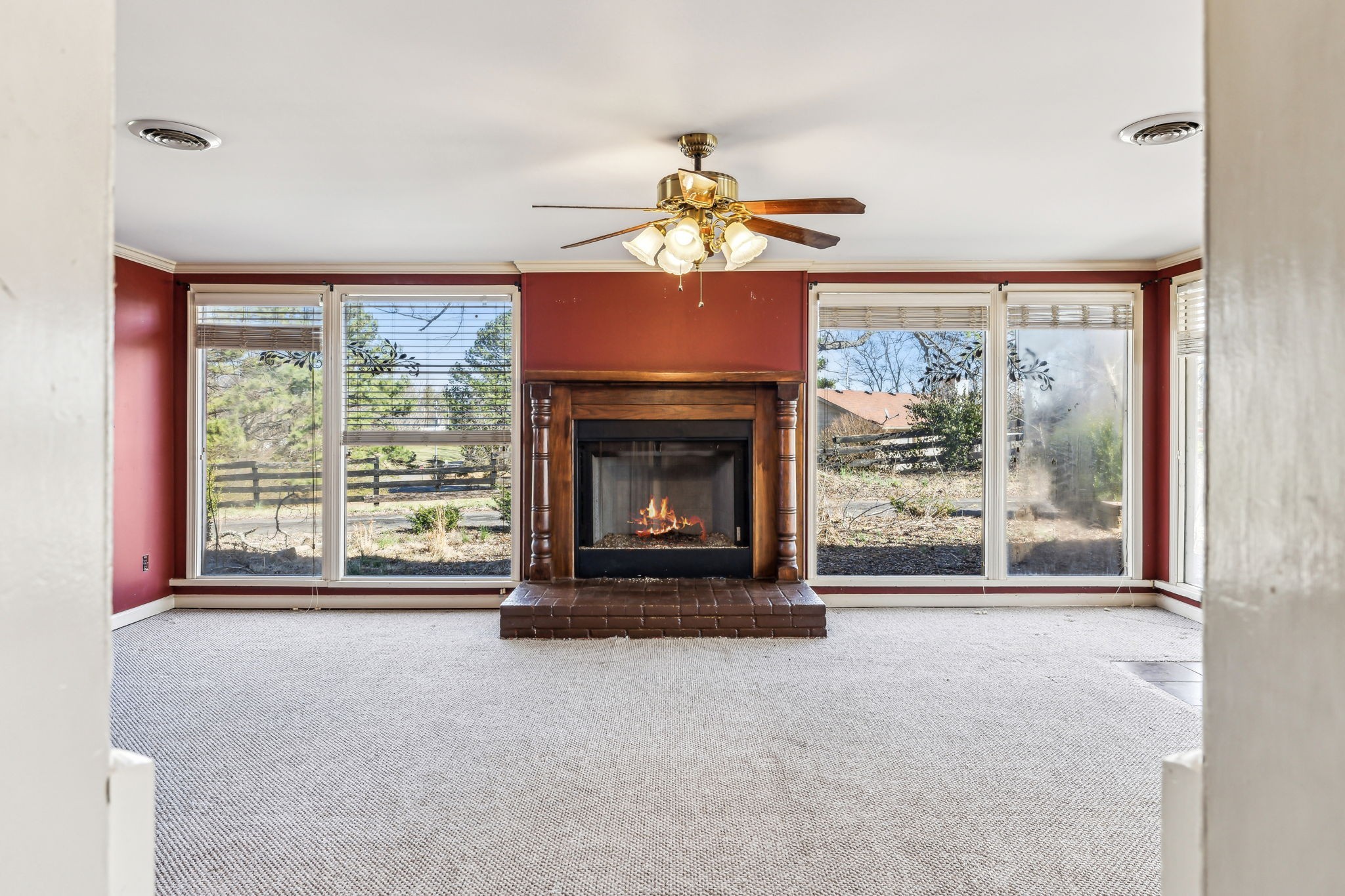 1170 Jim Read Road Ashland City, TN 37015 - Photo 21 of 39 a living room with fireplace furniture a large window and a fireplace