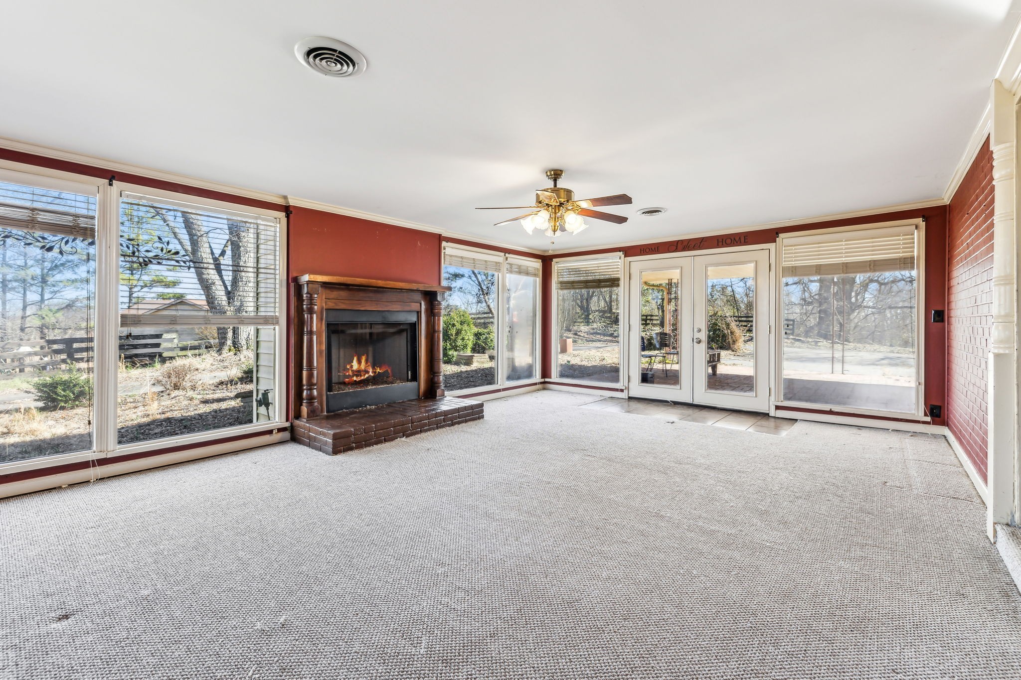 1170 Jim Read Road Ashland City, TN 37015 - Photo 24 of 39 a view of an empty room with a fireplace and a window