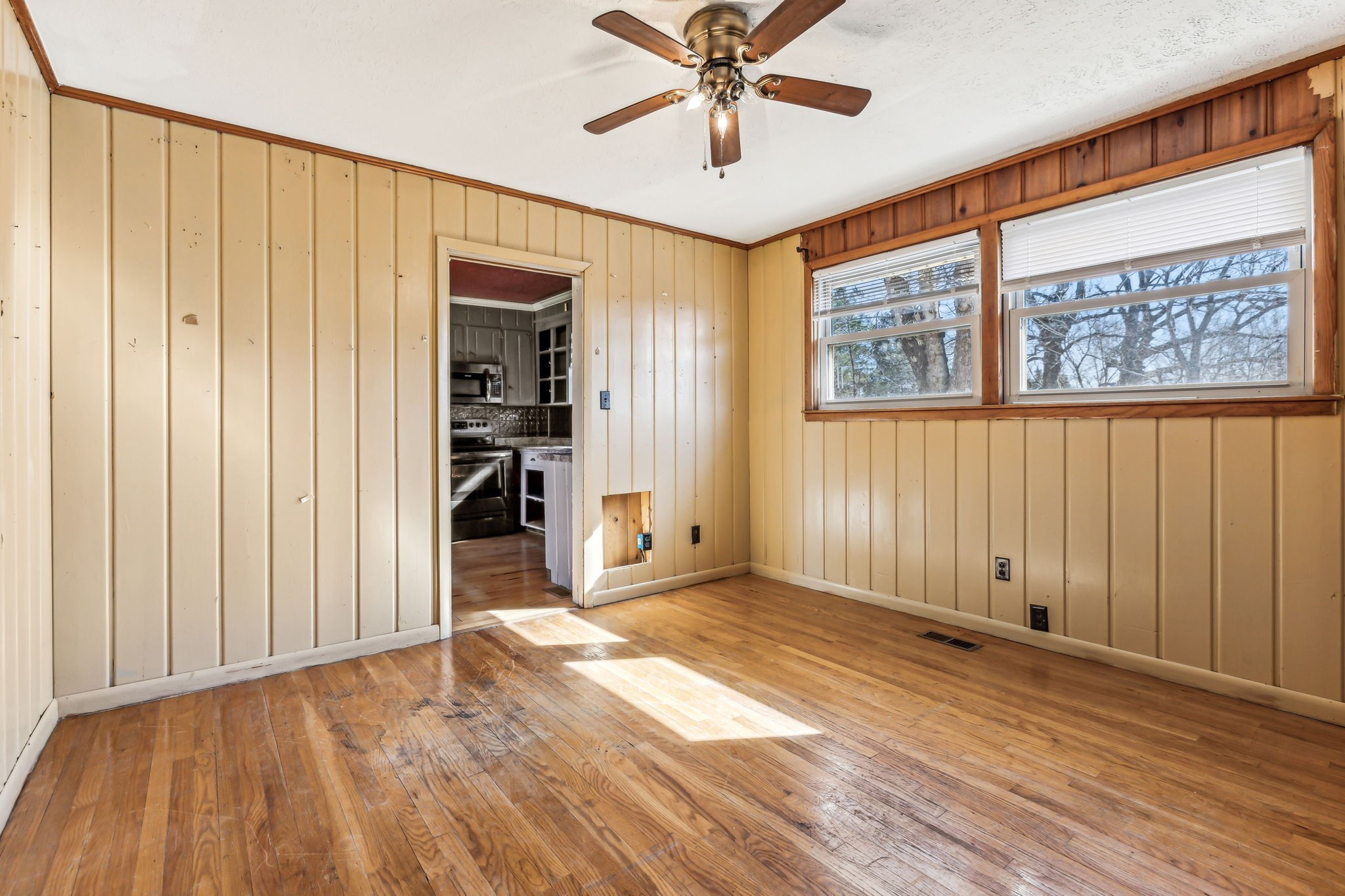 1170 Jim Read Road Ashland City, TN 37015 - Photo 27 of 39 an empty room with wooden floor closet and windows