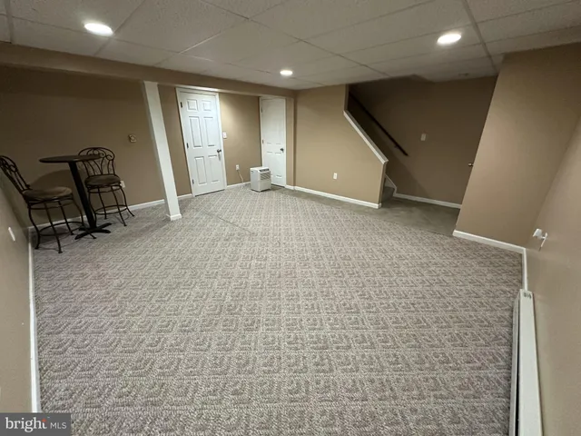 a view of a livingroom with gym equipment