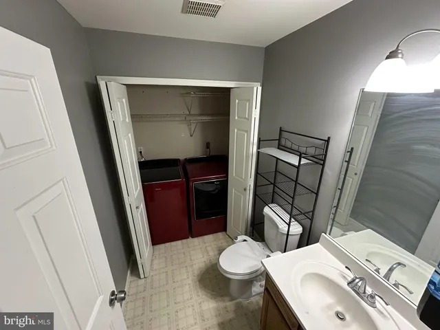a bathroom with a sink and toilet