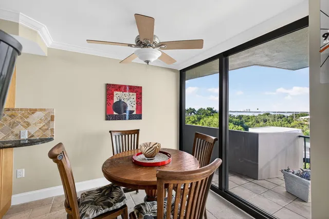 a view of a dining room with furniture window and outside view
