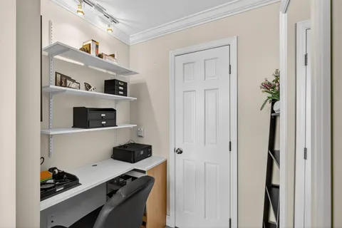 a view of workspace with wooden shelves