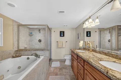 a bathroom with a bathtub and shower