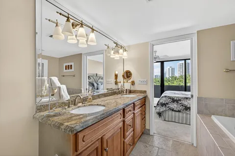 a bathroom with a tub and a shower