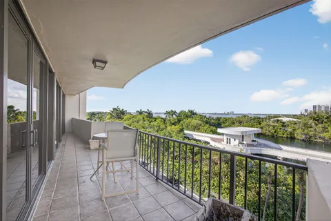 a view of balcony with furniture