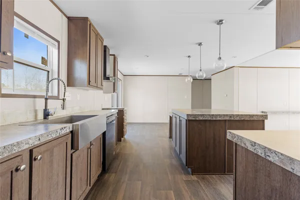 a view of a kitchen with a sink cabinets and a window