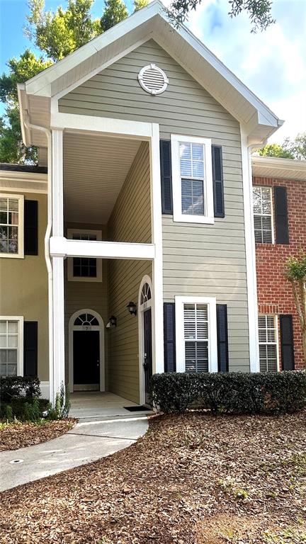 a front view of a house with yard