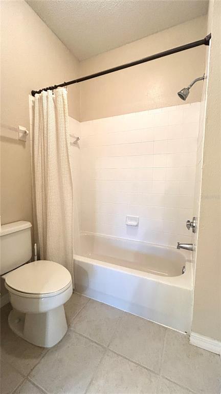10000 Southwest 52nd Avenue, Unit 7 Gainesville, FL 32608 - Photo 20 of 24 a bathroom with a shower and a toilet