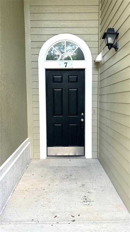 10000 Southwest 52nd Avenue, Unit 7 Gainesville, FL 32608 - Photo 2 of 24 a view of a entryway door front of a house