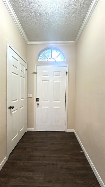 10000 Southwest 52nd Avenue, Unit 7 Gainesville, FL 32608 - Photo 3 of 24 a view of an empty room with wooden floor and a window