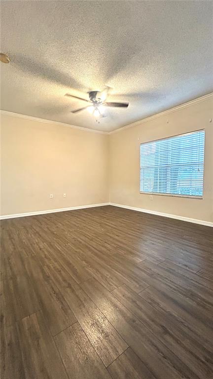 10000 Southwest 52nd Avenue, Unit 7 Gainesville, FL 32608 - Photo 6 of 24 an empty room with wooden floor and windows