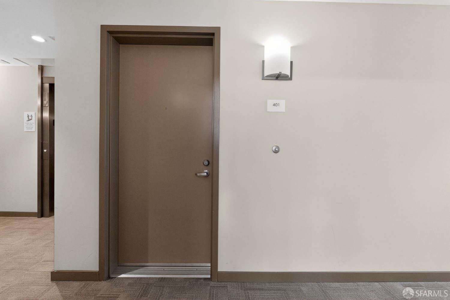 10 Innes Court, Unit 401 San Francisco, CA 94124 - Photo 2 of 33 a view of a hallway with wooden floor