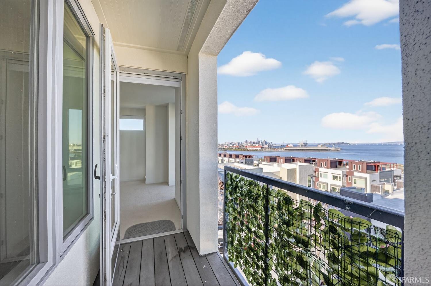 10 Innes Court, Unit 401 San Francisco, CA 94124 - Photo 21 of 33 a view of a balcony with wooden floor