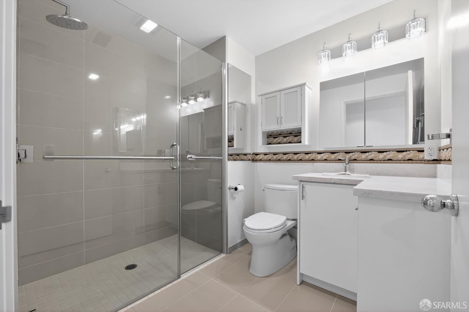 10 Innes Court, Unit 401 San Francisco, CA 94124 - Photo 22 of 33 a bathroom with a sink a toilet and shower