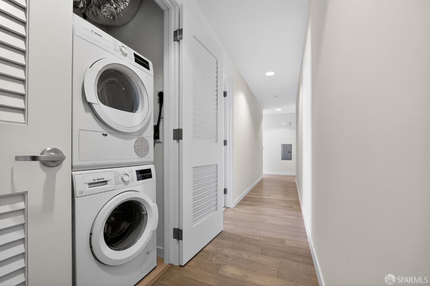 10 Innes Court, Unit 401 San Francisco, CA 94124 - Photo 30 of 33 a view of a hallway with washer and dryer