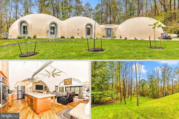 a view of a white house with a backyard