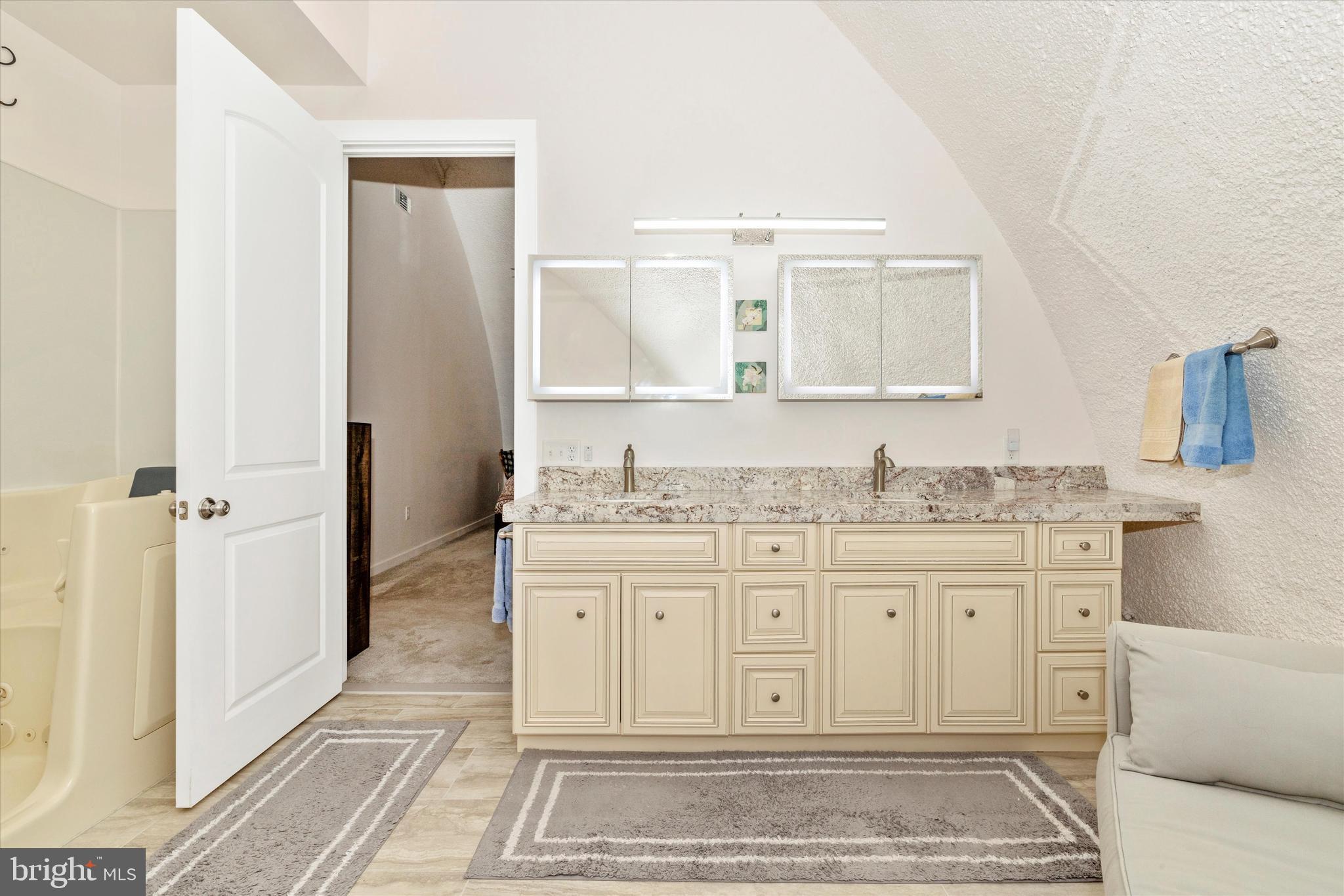 4940 Fox Tower Road Smithsburg, MD 21783 - Photo 20 of 41 a bathroom with a granite countertop sink and a mirror