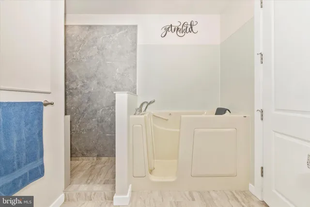 a bedroom with a bed and flat screen tv