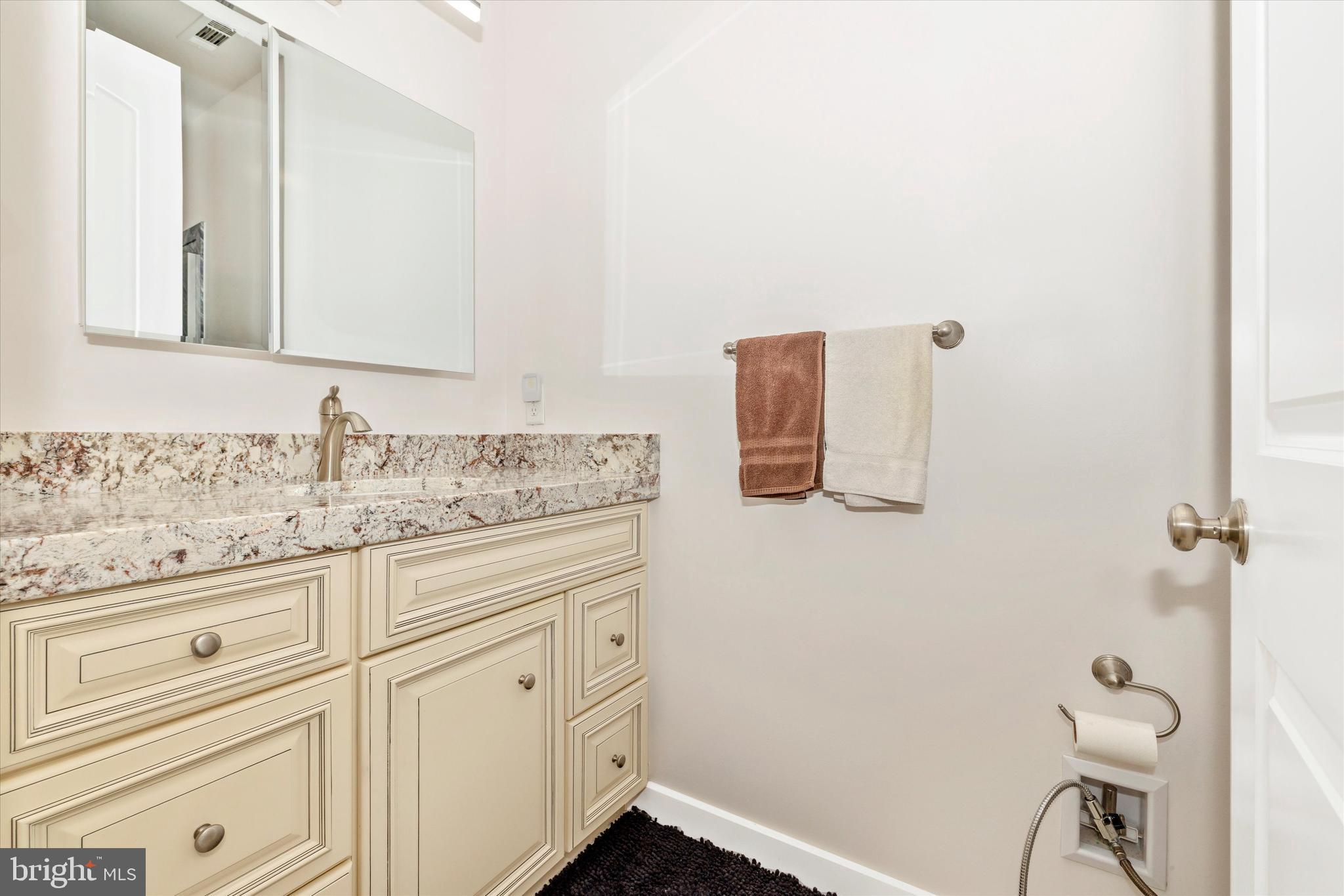 4940 Fox Tower Road Smithsburg, MD 21783 - Photo 27 of 41 a bathroom with a granite countertop sink and a mirror