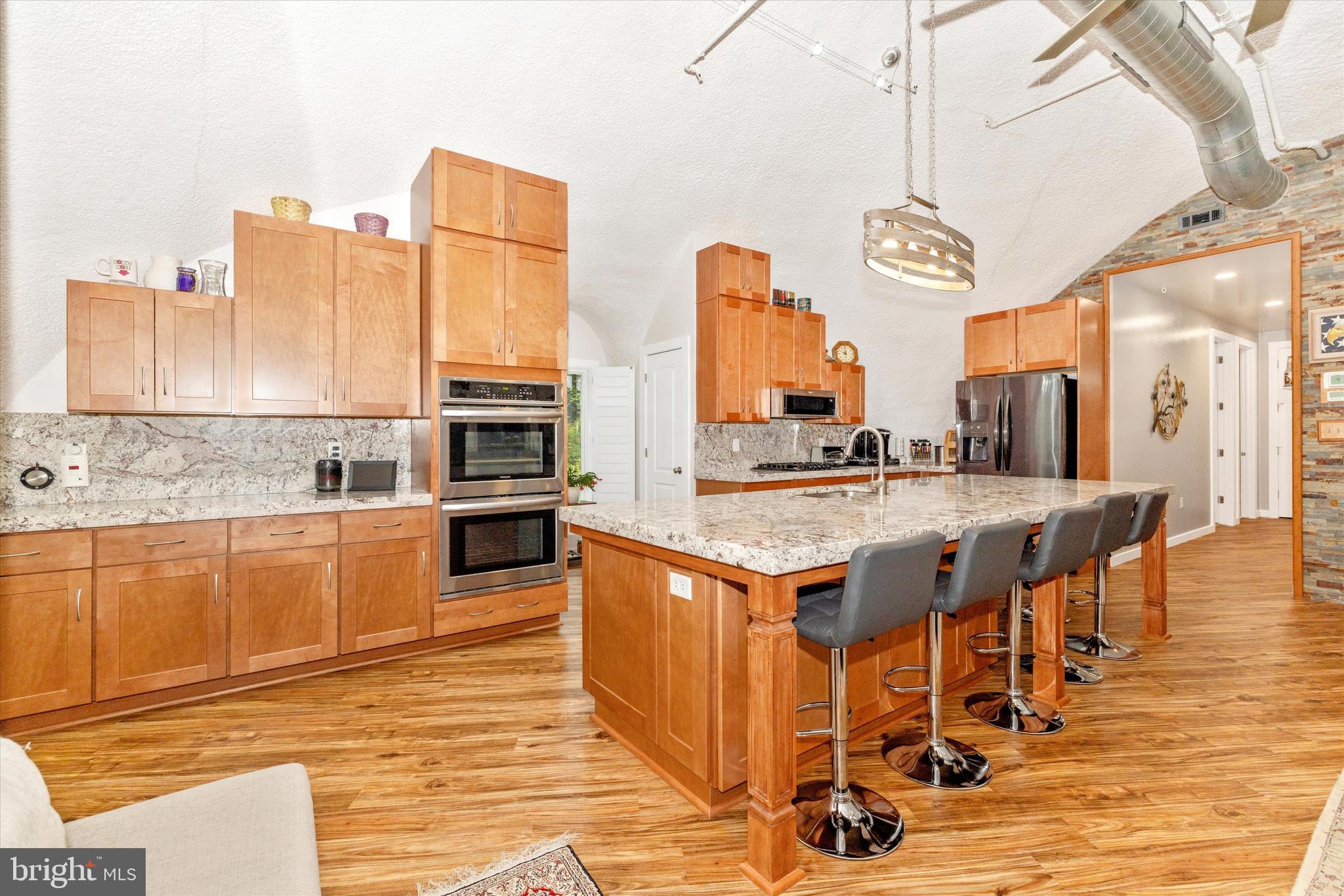 4940 Fox Tower Road Smithsburg, MD 21783 - Photo 4 of 41 a kitchen with stainless steel appliances granite countertop a stove and cabinets