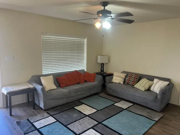 a living room with furniture and a window