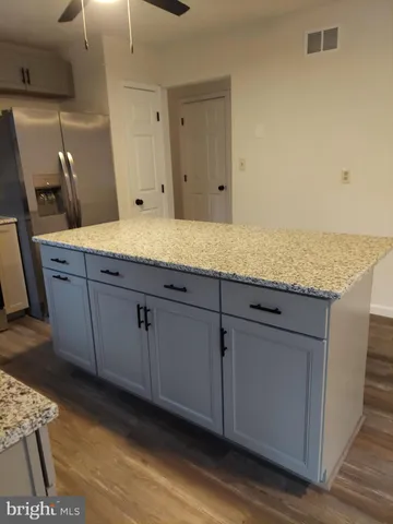a view of cabinets and wooden floor