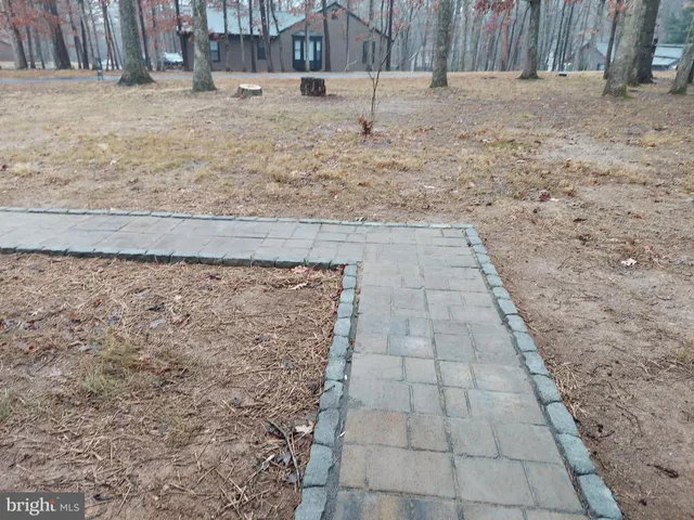 a view of a backyard of the house