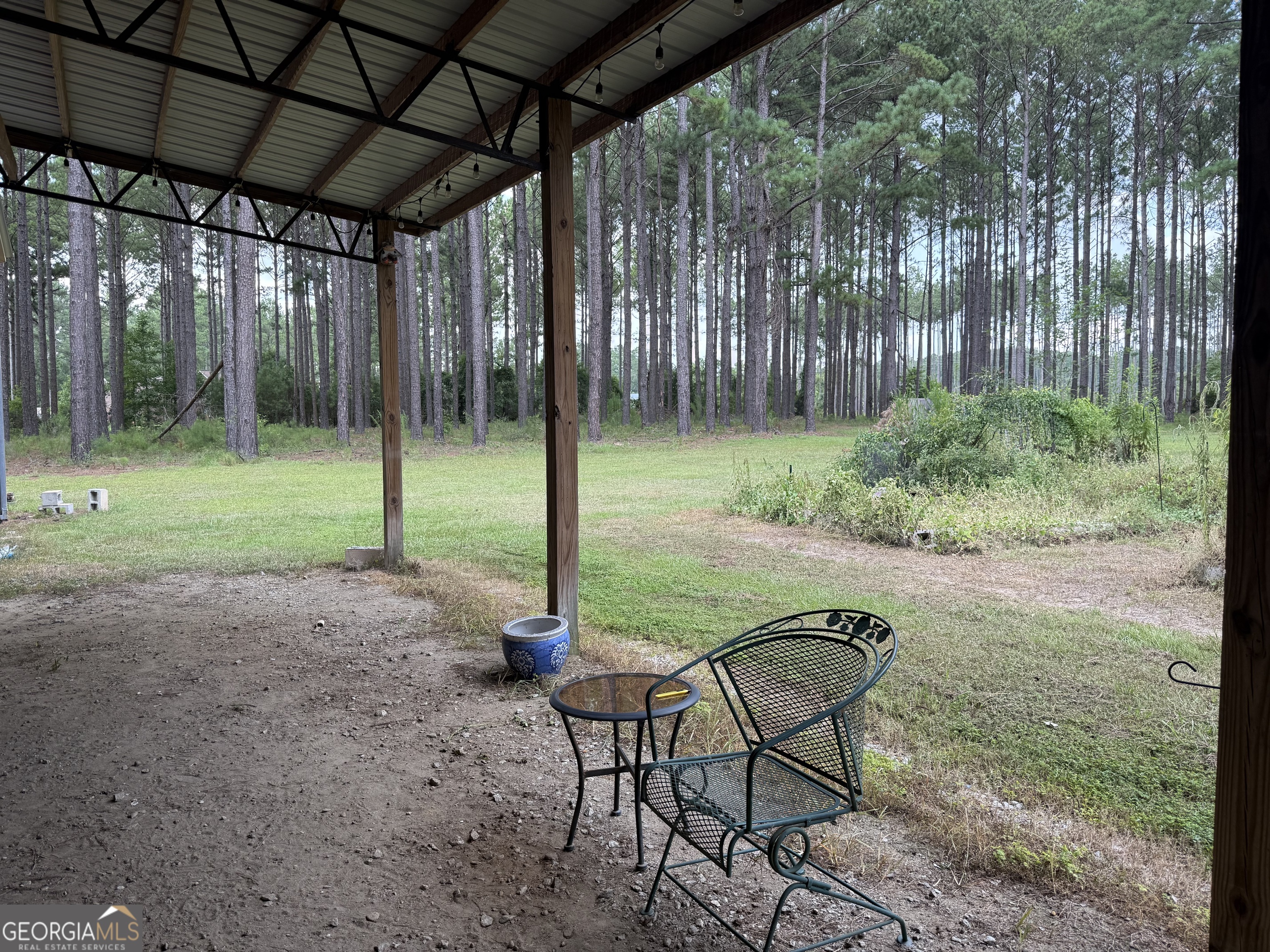 1550 Adabelle Road South Register, GA 30452 - Photo 14 of 20 a backyard of a house with table and chairs