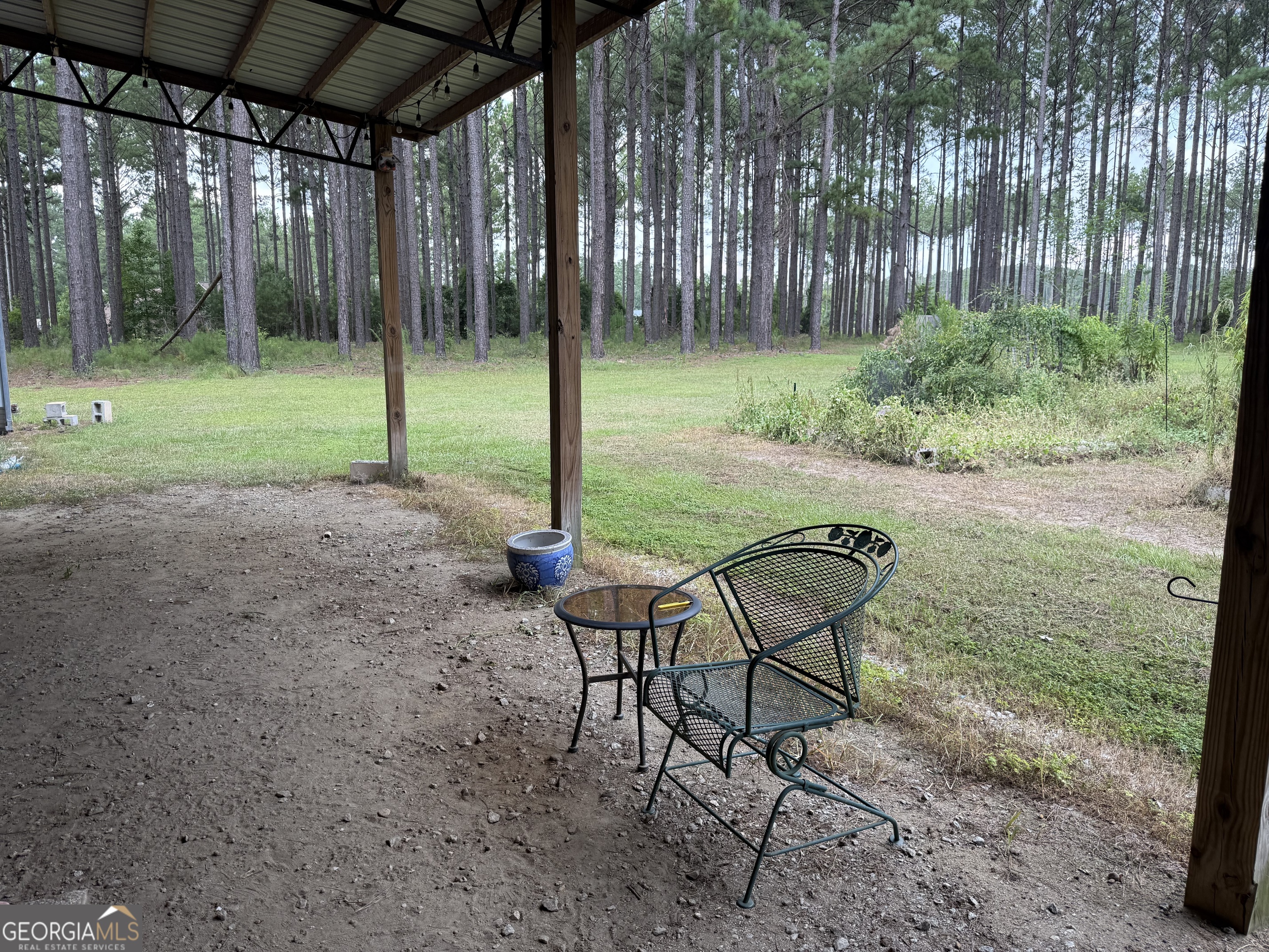 1550 Adabelle Road South Register, GA 30452 - Photo 5 of 20 a backyard of a house with table and chairs