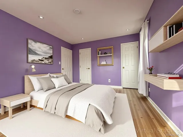 a spacious bedroom with a bed and a couch