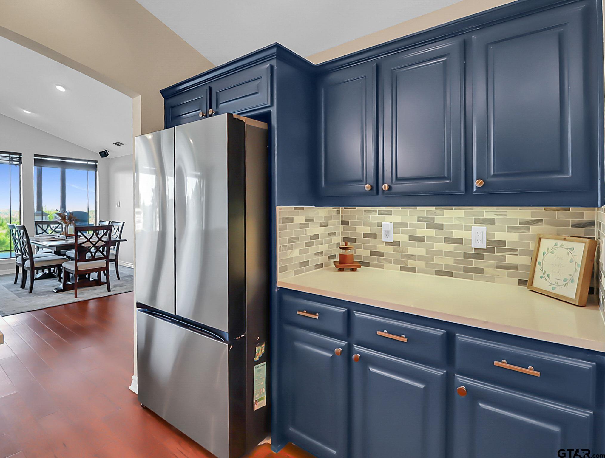 307 Roesch Road Hallsville, TX 75650 - Photo 12 of 40 a kitchen with stainless steel appliances granite countertop a refrigerator and a stove top oven