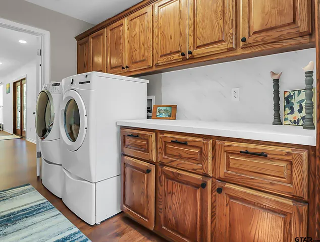 a utility room with dryer and washer