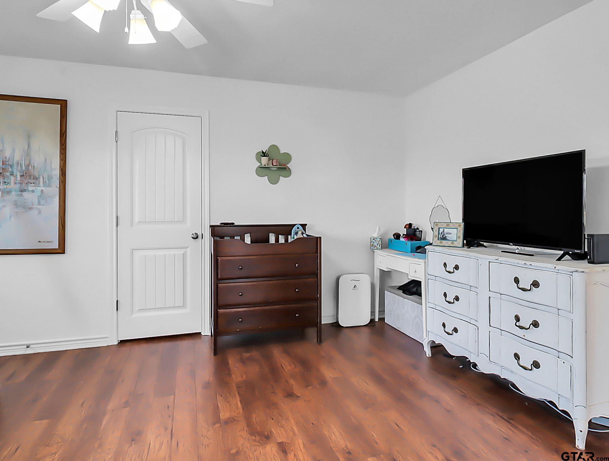 307 Roesch Road Hallsville, TX 75650 - Photo 25 of 40 a living room with furniture and flat screen tv