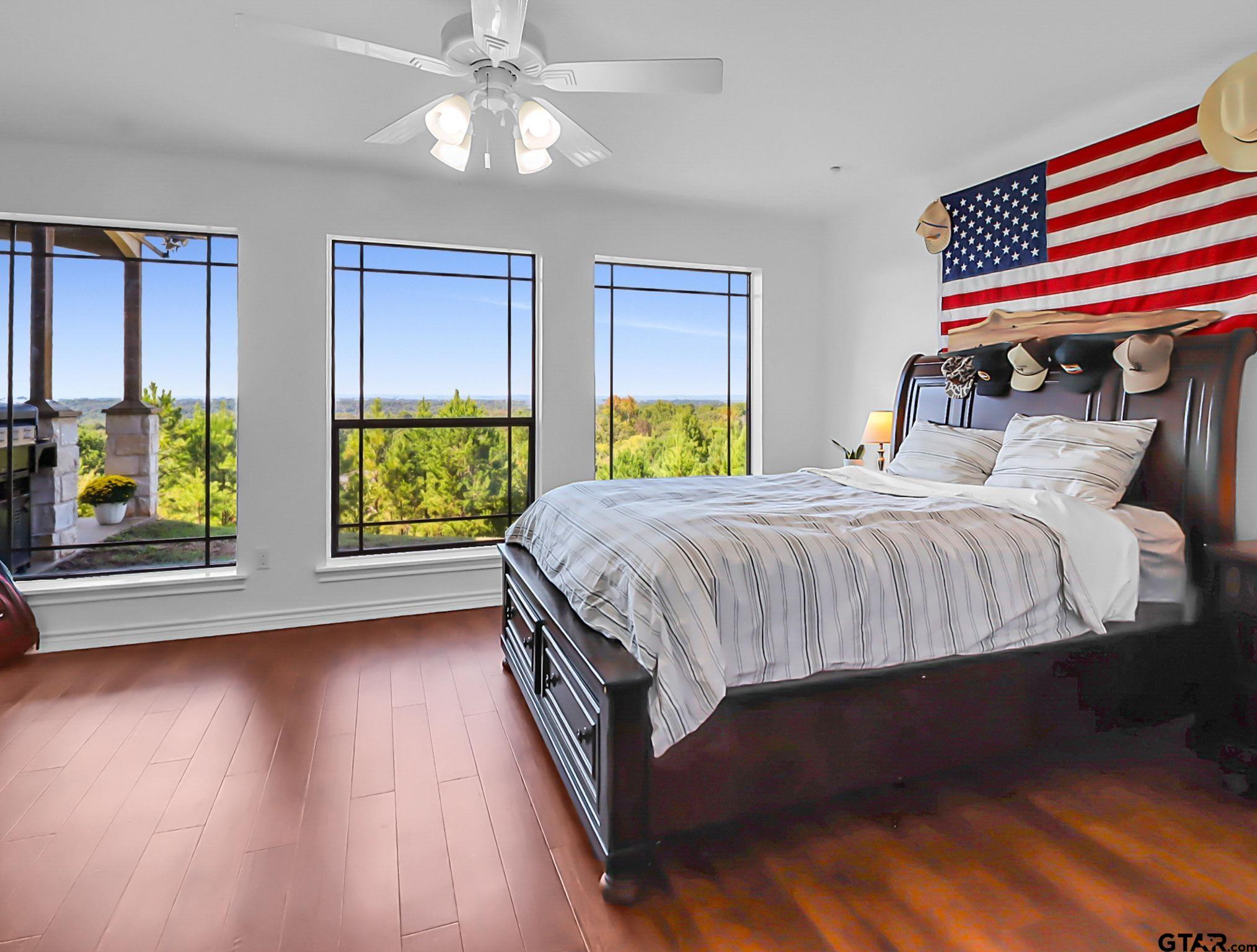 307 Roesch Road Hallsville, TX 75650 - Photo 28 of 40 a bedroom with a bed a dresser next to a window