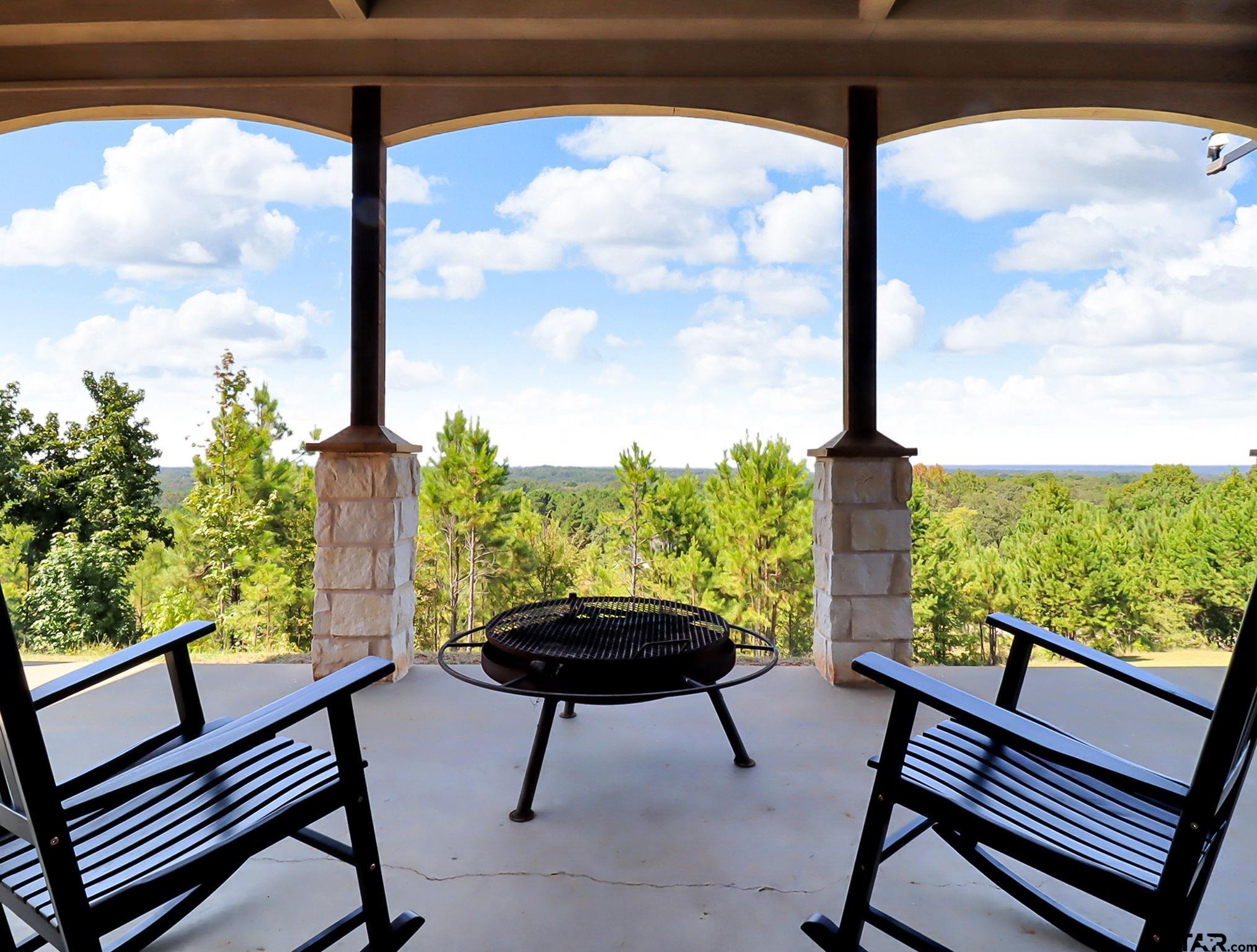 307 Roesch Road Hallsville, TX 75650 - Photo 36 of 40 a view of a porch with furniture and a yard