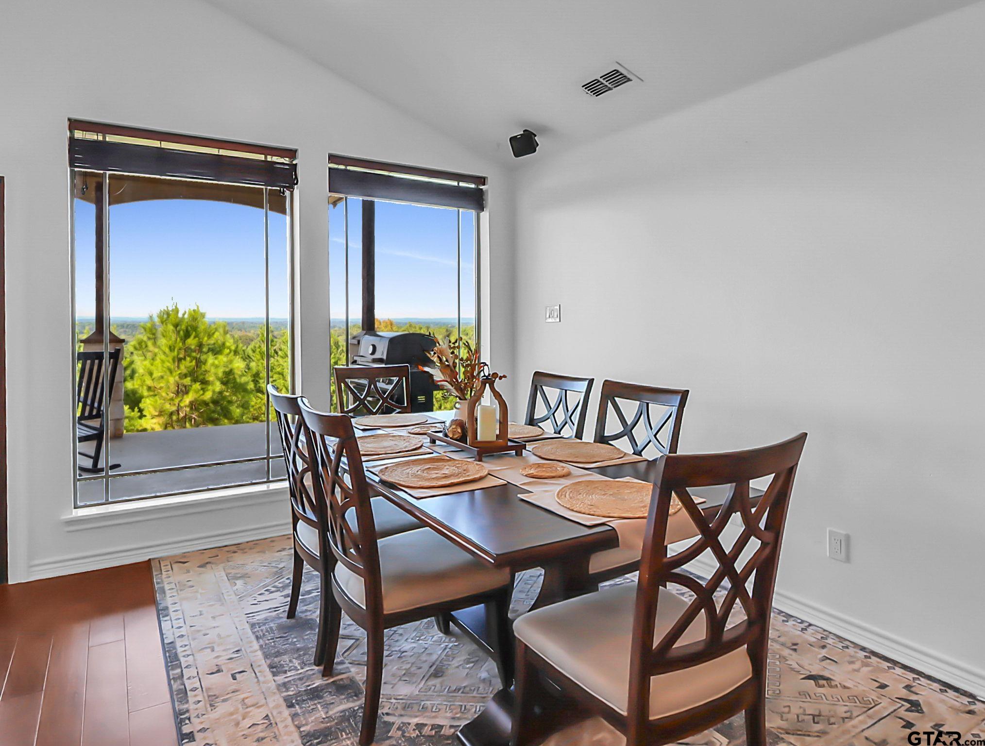 307 Roesch Road Hallsville, TX 75650 - Photo 8 of 40 a dining room with furniture and wooden floor