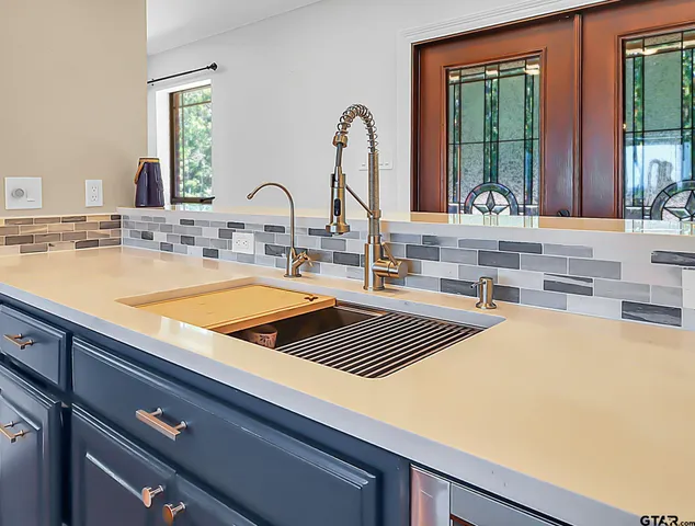 a kitchen with a sink and a window