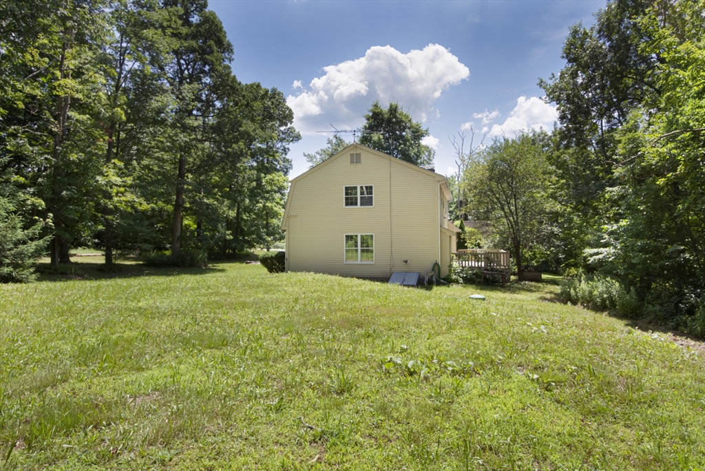 4 Walker Pond Road Sturbridge, MA 01566 - Photo 4 of 41 a view of a house with a yard and garage
