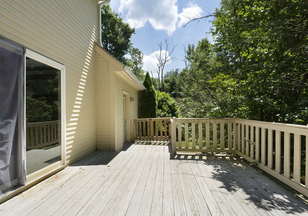 4 Walker Pond Road Sturbridge, MA 01566 - Photo 6 of 41 a view of balcony with wooden floor and fence