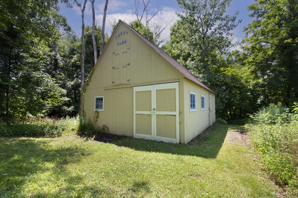 4 Walker Pond Road Sturbridge, MA 01566 - Photo 7 of 41 a view of a house with backyard
