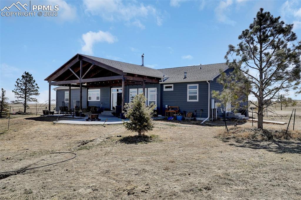 24335 Sweet Road Calhan, CO 80808 - Photo 1 of 39 a front view of a house with a yard