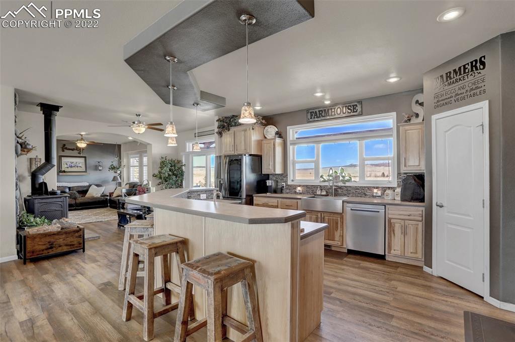 24335 Sweet Road Calhan, CO 80808 - Photo 12 of 39 a large kitchen with a large counter top appliances and cabinets
