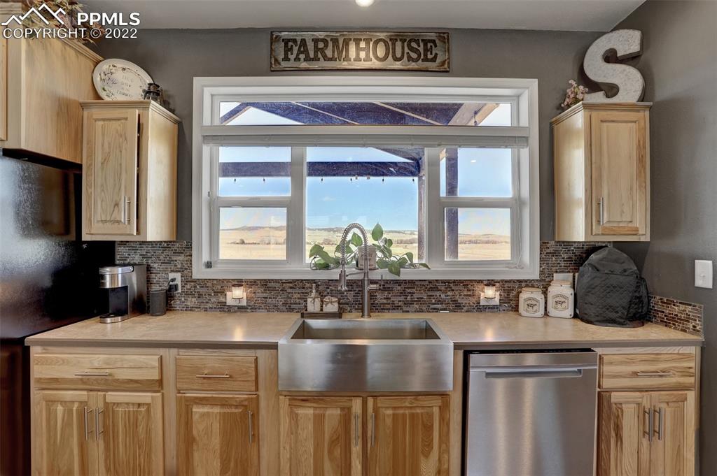 24335 Sweet Road Calhan, CO 80808 - Photo 18 of 39 a kitchen with a sink and a cabinets